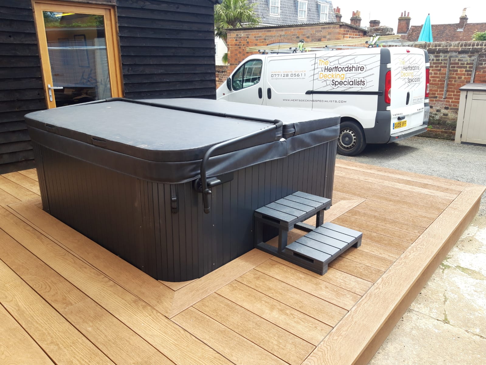 Hot-tub with Millboard surround.